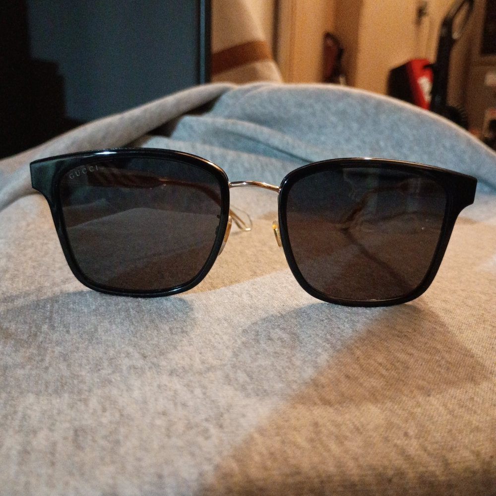 Gucci Black Frame Sunglasses with Gold Bridge